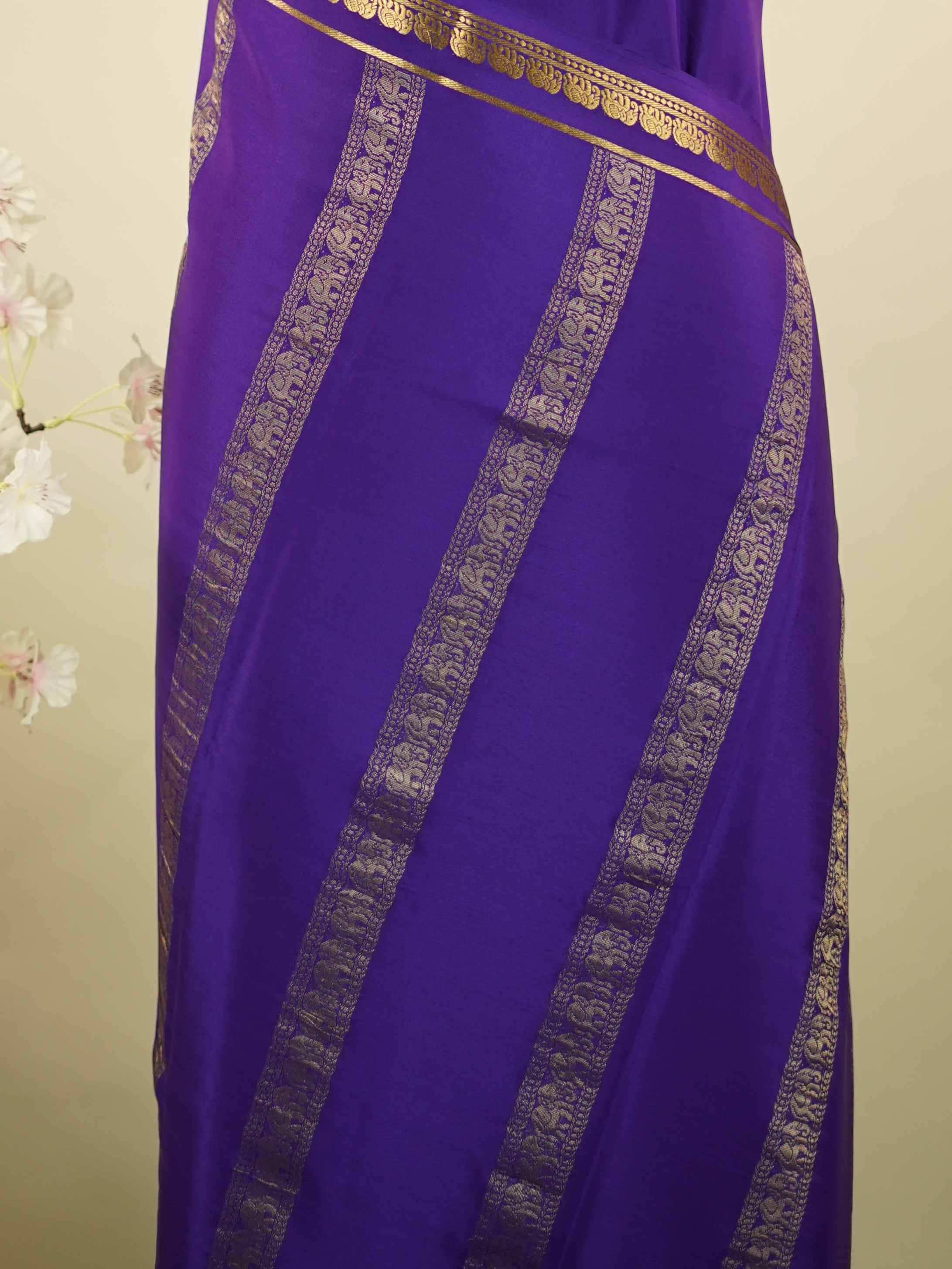 Mysore silk Plain Mysore silk saree accented with delicate small elephant borders.br
A subtle statement of heritage and elegance, woven into timeless simplicity. Kaumari - Pure Mysore Silk Saree | Elephant Border - Manoranjitham Weaves - Handloom Store