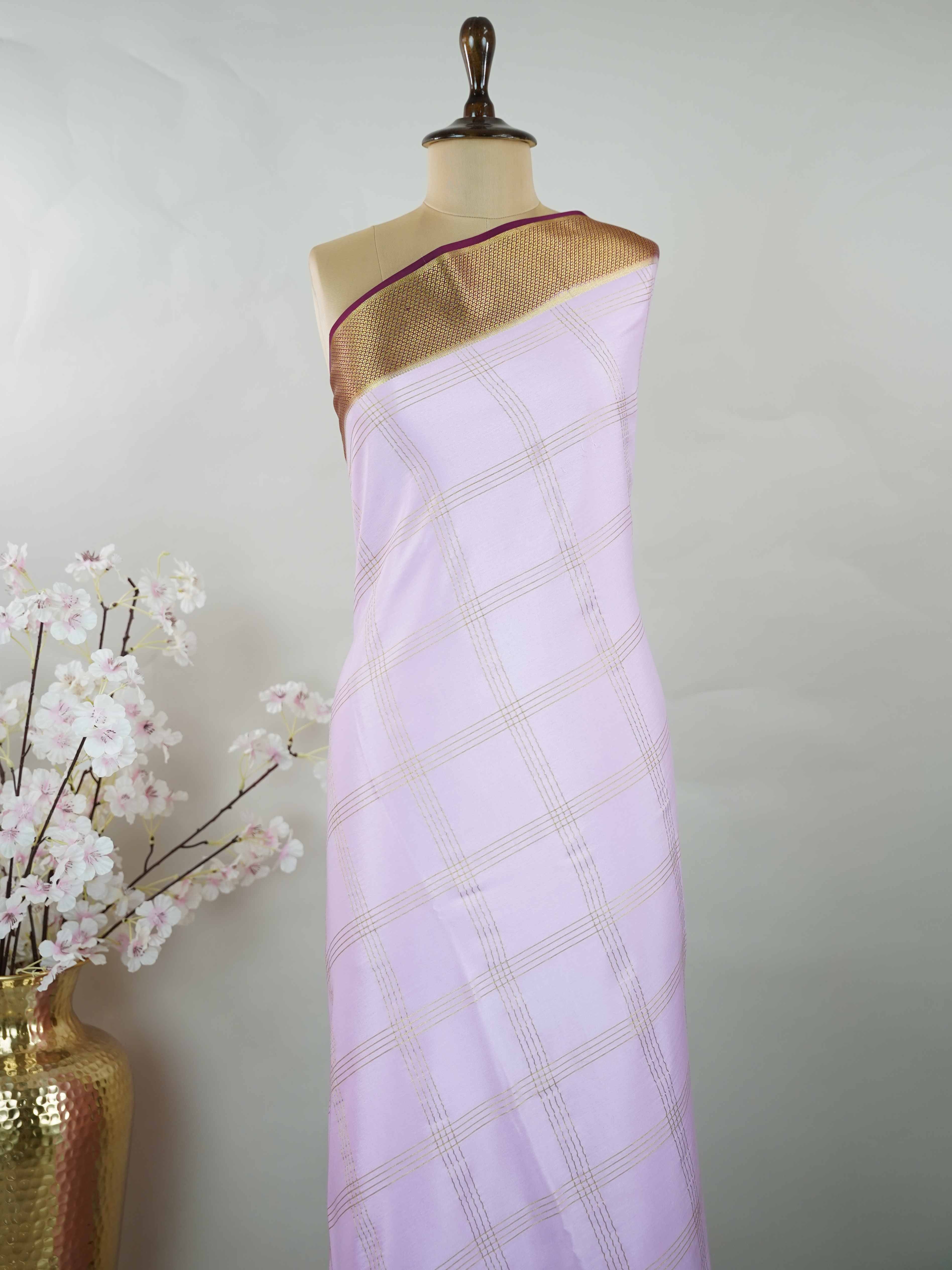 Mysore silk Pure Mysore silk saree featuring understated elegance and charm. Traditional handloom weaving enhances its rich appeal. Soft silk texture offers comfort throughout the day. Simple detailing makes it beautifully versatile. A timeless saree for every wardrobe. Mridulangi - Pure Mysore Silk Saree - Manoranjitham Weaves - Handloom Store