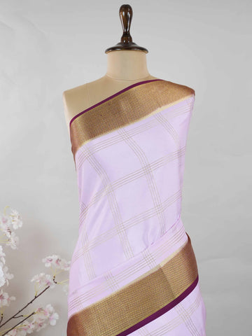 Mysore silk Pure Mysore silk saree featuring understated elegance and charm. Traditional handloom weaving enhances its rich appeal. Soft silk texture offers comfort throughout the day. Simple detailing makes it beautifully versatile. A timeless saree for every wardrobe. Mridulangi - Pure Mysore Silk Saree - Manoranjitham Weaves - Handloom Store