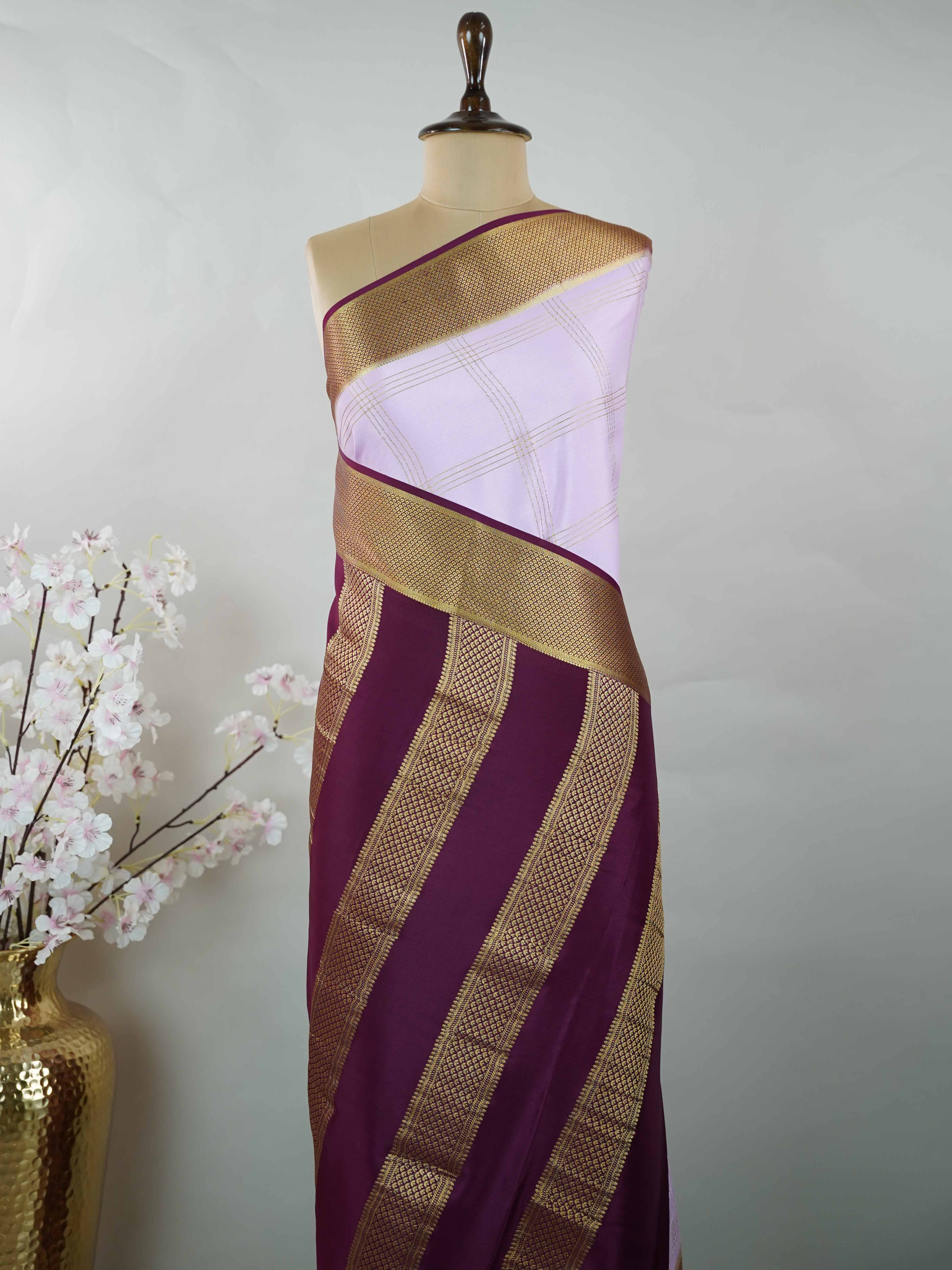 Mysore silk Pure Mysore silk saree featuring understated elegance and charm. Traditional handloom weaving enhances its rich appeal. Soft silk texture offers comfort throughout the day. Simple detailing makes it beautifully versatile. A timeless saree for every wardrobe. Mridulangi - Pure Mysore Silk Saree - Manoranjitham Weaves - Handloom Store