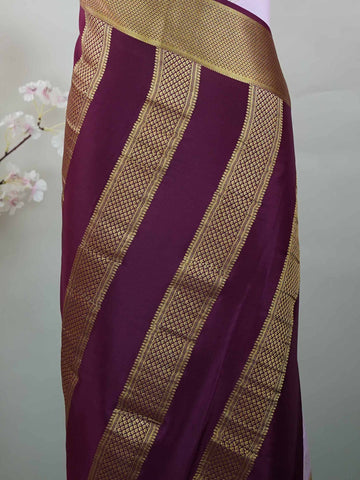 Mysore silk Pure Mysore silk saree featuring understated elegance and charm. Traditional handloom weaving enhances its rich appeal. Soft silk texture offers comfort throughout the day. Simple detailing makes it beautifully versatile. A timeless saree for every wardrobe. Mridulangi - Pure Mysore Silk Saree - Manoranjitham Weaves - Handloom Store