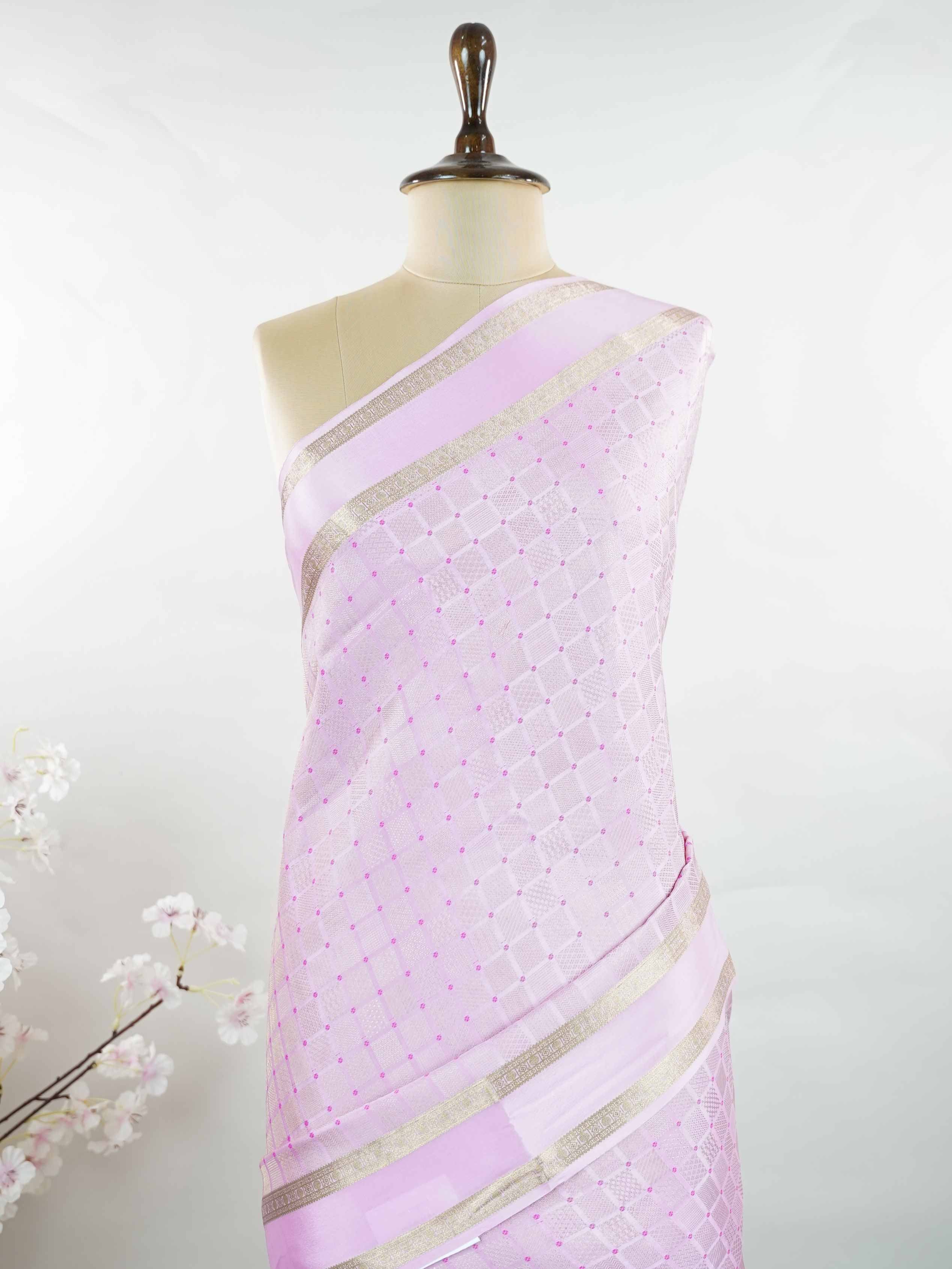 Mysore silk An elegant handloom Mysore silk saree with subtle richness. The graceful weave reflects timeless beauty naturally. Simple styling makes it versatile and refined. Soft texture ensures comfortable draping. A classic saree for every special occasion. Latangi - Pure Mysore Silk Saree - Manoranjitham Weaves - Handloom Store