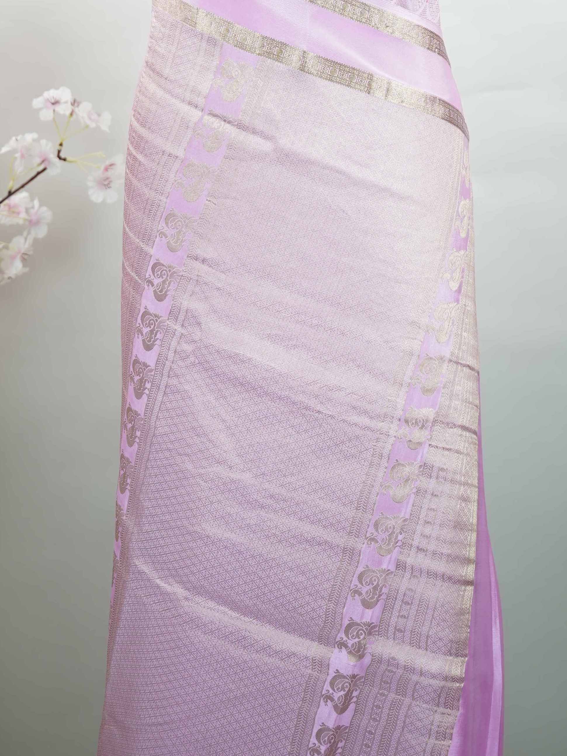 Mysore silk An elegant handloom Mysore silk saree with subtle richness. The graceful weave reflects timeless beauty naturally. Simple styling makes it versatile and refined. Soft texture ensures comfortable draping. A classic saree for every special occasion. Latangi - Pure Mysore Silk Saree - Manoranjitham Weaves - Handloom Store