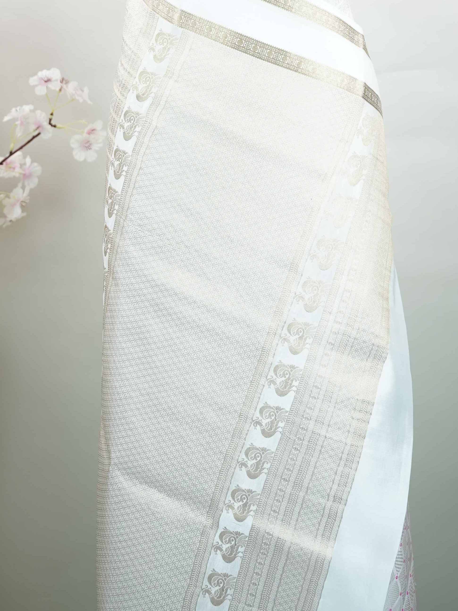 Mysore silk Classic Mysore silk saree featuring pure handloom craftsmanship. Soft silk texture offers effortless elegance and comfort. Its refined finish adds timeless sophistication. Perfect for elegant festive styling. A beautiful expression of traditional weaving. Ratnangi - Pure Mysore Silk Saree - Manoranjitham Weaves - Handloom Store
