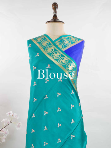 Mysore silk Rich blue Mysore silk featuring traditional checks and intricately woven Gandaberunda motifs across the body. A graceful Mysore silk saree crafted using pure handloom techniques. Its soft silk weave offers elegance with comfort. Simple styling adds timeless sophistication. Woven to reflect heritage and artistry. A beautiful saree for every occasion.brA graceful blend of heritage craftsmanship and timeless South Indian elegance. Tejomayi - Blue Pure Mysore Silk Saree | Gandaberunda Motifs - Manor