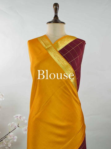 Mysore silk Pure Mysore silk in a rich maroon hue, complemented by classic checks woven gracefully across the body.br
Paired with a vibrant mustard yellow contrast, this weave exudes timeless charm and quiet sophistication. Vilasini - Maroon Pure Mysore Silk Saree | Classic Checks - Manoranjitham Weaves - Handloom Store
