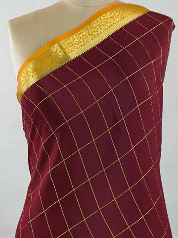 Mysore silk Pure Mysore silk in a rich maroon hue, complemented by classic checks woven gracefully across the body.br
Paired with a vibrant mustard yellow contrast, this weave exudes timeless charm and quiet sophistication. Vilasini - Maroon Pure Mysore Silk Saree | Classic Checks - Manoranjitham Weaves - Handloom Store