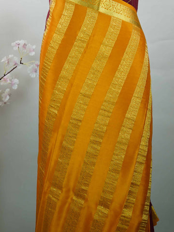 Mysore silk Pure Mysore silk in a rich maroon hue, complemented by classic checks woven gracefully across the body.br
Paired with a vibrant mustard yellow contrast, this weave exudes timeless charm and quiet sophistication. Vilasini - Maroon Pure Mysore Silk Saree | Classic Checks - Manoranjitham Weaves - Handloom Store