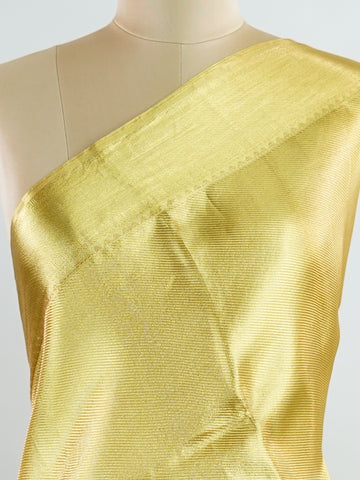Kanchipuram Silk Beautiful bridal Kanjivaram saree featuring a rich Settled Gold body, gracefully complemented by a matching Gold border and elegant Gold pallu. The luxurious golden hue exudes timeless grandeur, creating a regal and sophisticated bridal appearance. Expertly woven with exquisite Kanjivaram craftsmanship, the saree reflects heritage, elegance, and unmatched beauty. Paired with a suitable Gold blouse, this magnificent drape is perfect for weddings, receptions, and grand traditional celebration
