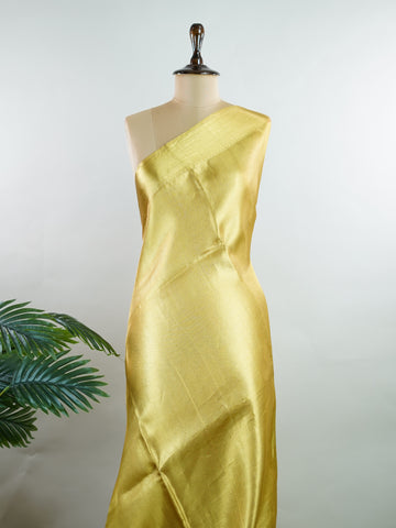Kanchipuram Silk Beautiful bridal Kanjivaram saree featuring a rich Settled Gold body, gracefully complemented by a matching Gold border and elegant Gold pallu. The luxurious golden hue exudes timeless grandeur, creating a regal and sophisticated bridal appearance. Expertly woven with exquisite Kanjivaram craftsmanship, the saree reflects heritage, elegance, and unmatched beauty. Paired with a suitable Gold blouse, this magnificent drape is perfect for weddings, receptions, and grand traditional celebration