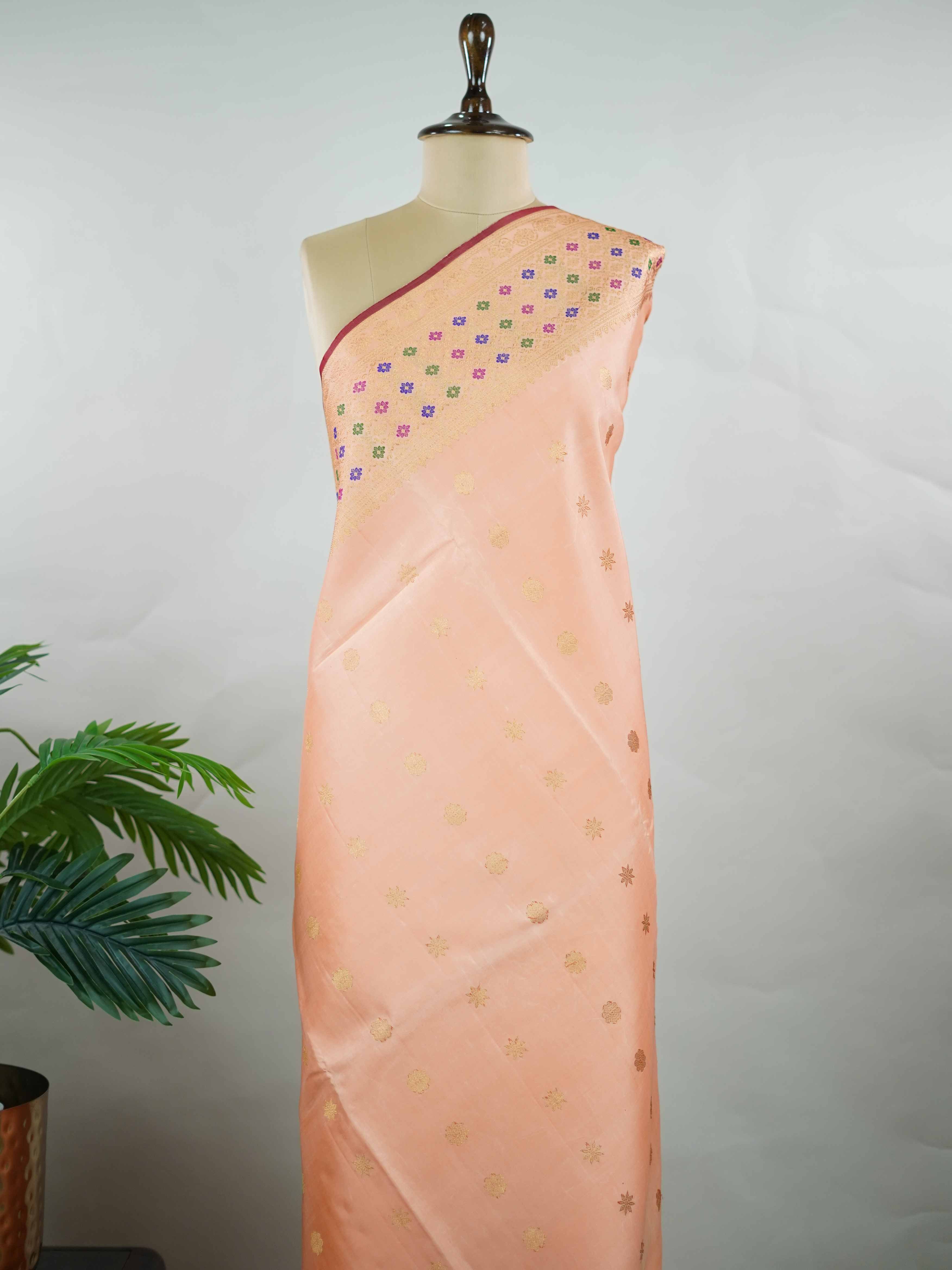 Gadwal Silk This Gadwal silk saree, adorned in Pink and detailed with Pure Zari weaving, reflects the grandeur of Gadwal. The timeless Checks motifs enhance its bridal charm. A perfect blend of luxury and tradition, it is designed for those who appreciate fine craftsmanship. Mohanama - Pink Handloom Gadwal Silk Saree - Manoranjitham Weaves - Handloom Store