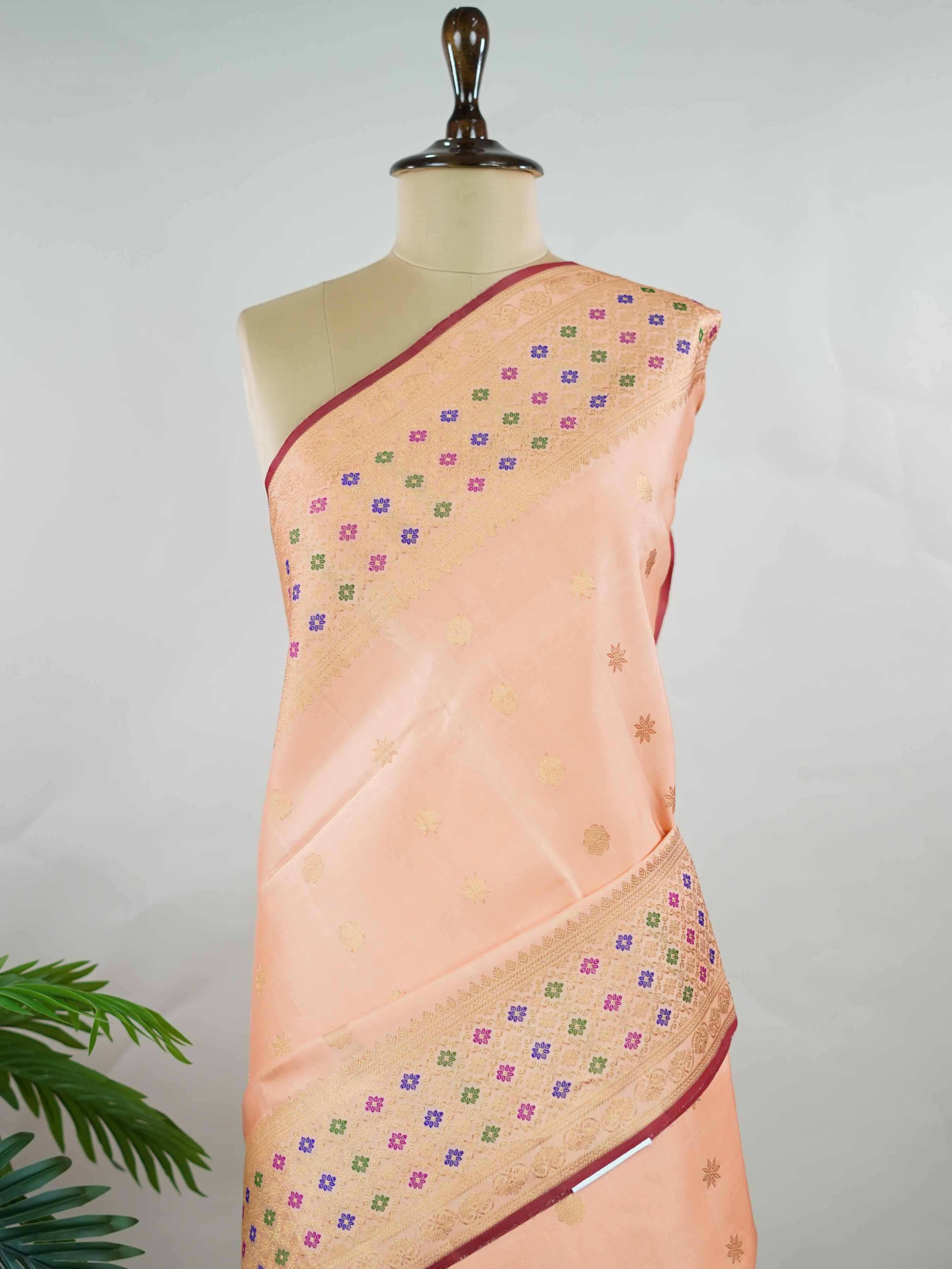 Gadwal Silk This Gadwal silk saree, adorned in Pink and detailed with Pure Zari weaving, reflects the grandeur of Gadwal. The timeless Checks motifs enhance its bridal charm. A perfect blend of luxury and tradition, it is designed for those who appreciate fine craftsmanship. Mohanama - Pink Handloom Gadwal Silk Saree - Manoranjitham Weaves - Handloom Store