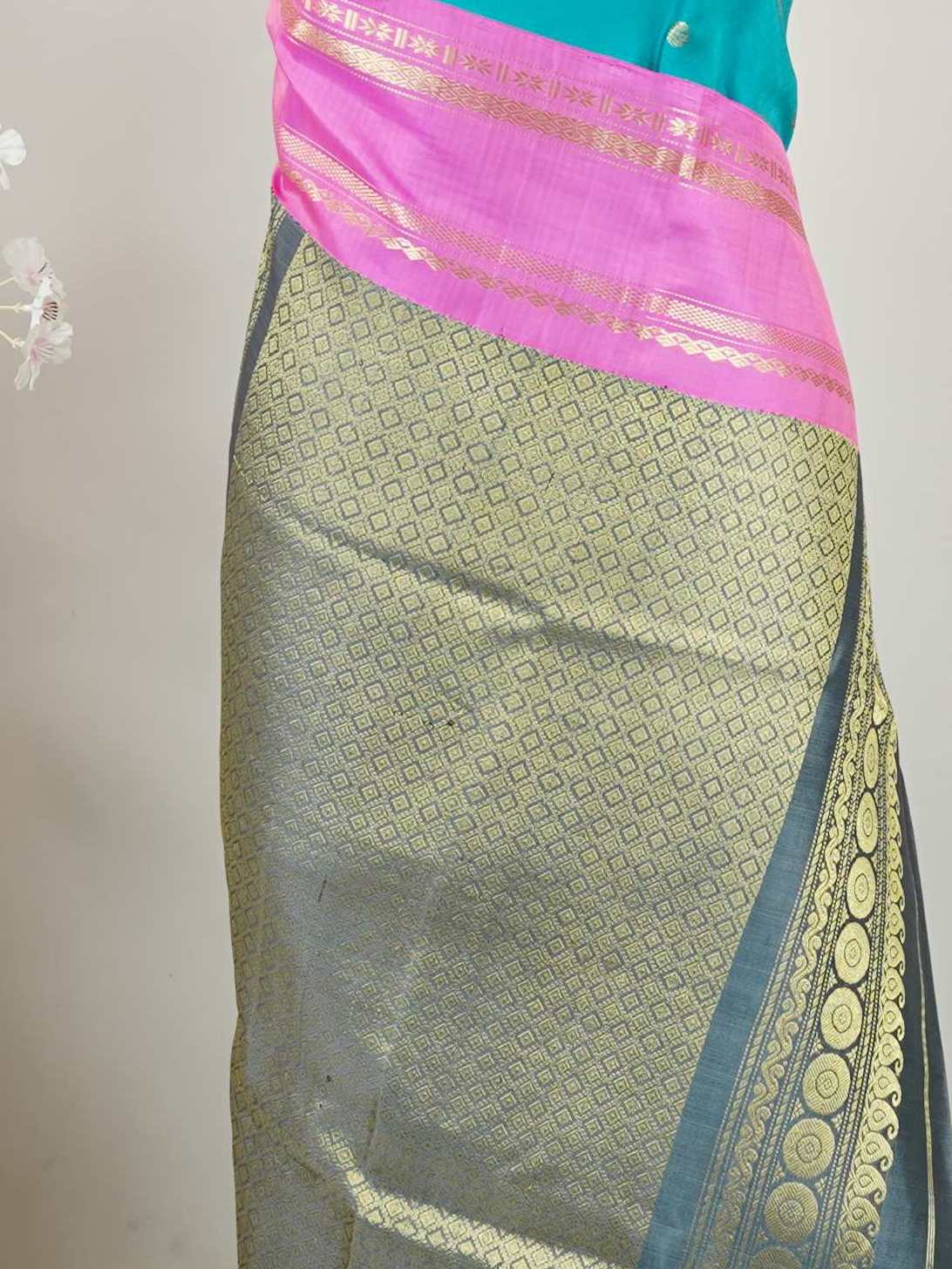 Gadwal Silk This Gadwal silk saree, adorned in Cyan and detailed with Pure Zari weaving, reflects the grandeur of Gadwal. The timeless Buttis motifs enhance its bridal charm. A perfect blend of luxury and tradition, it is designed for those who appreciate fine craftsmanship. Nattakurinji - Handloom Gadwal Silk Saree - Manoranjitham Weaves - Handloom Store