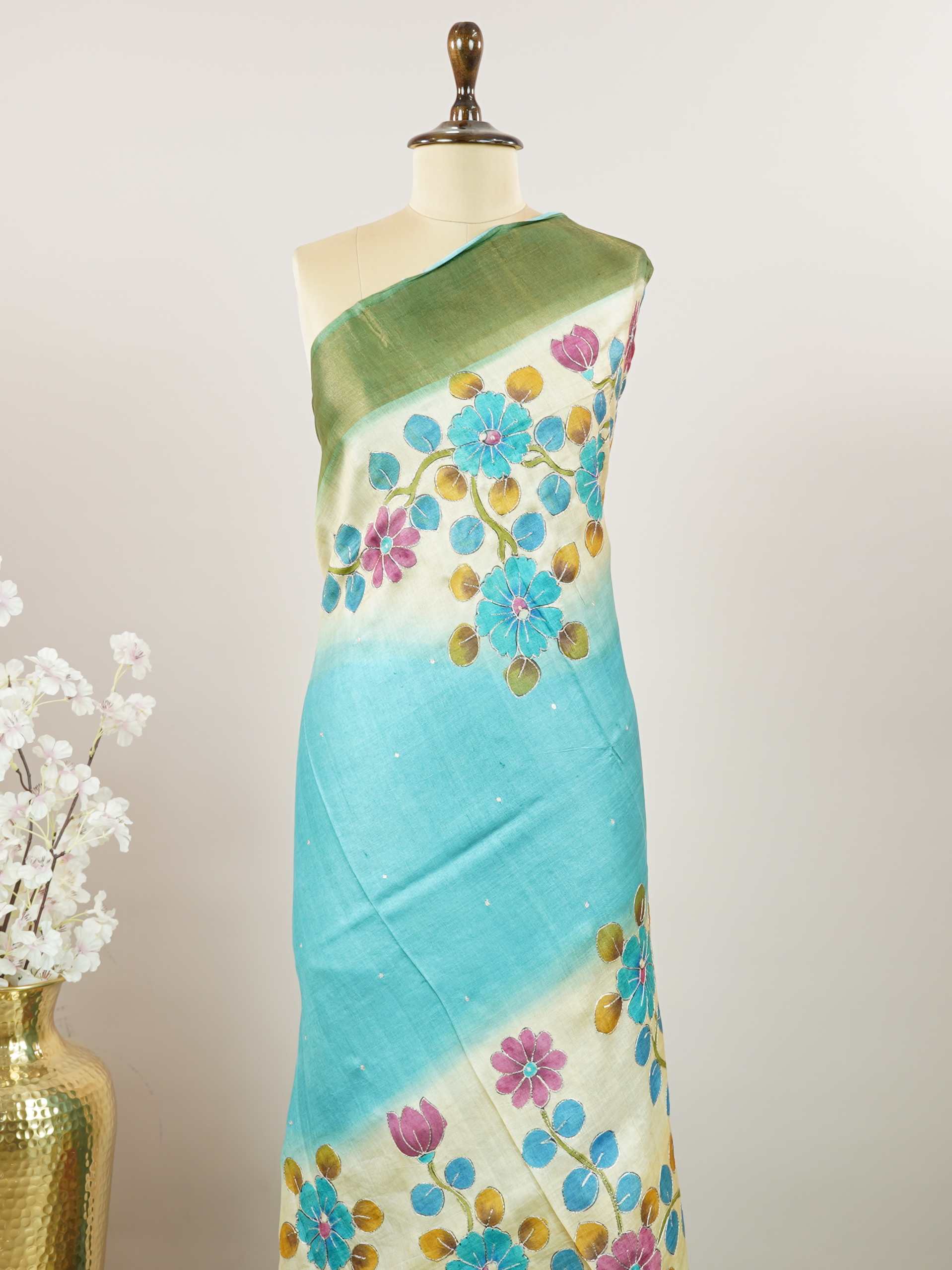 Tussars A Tussar saree with digital print and intricate Aari Peeta embroidery, combining modern design with delicate handcraft. Pahadi - Tussar Silk Saree | Digital Print - Manoranjitham Weaves - Handloom Store