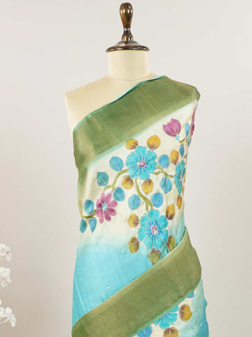 Tussars A Tussar saree with digital print and intricate Aari Peeta embroidery, combining modern design with delicate handcraft. Pahadi - Tussar Silk Saree | Digital Print - Manoranjitham Weaves - Handloom Store