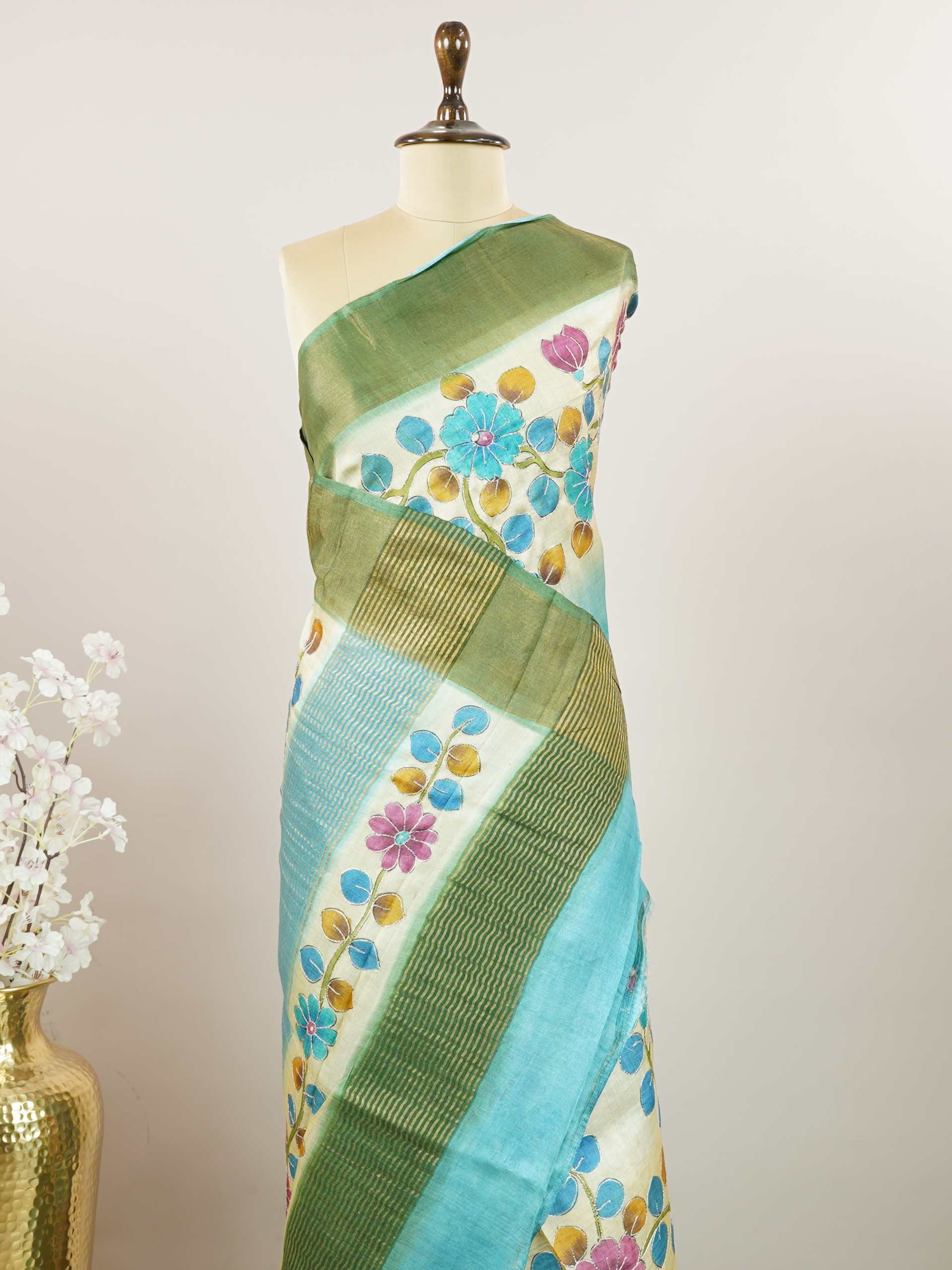 Tussars A Tussar saree with digital print and intricate Aari Peeta embroidery, combining modern design with delicate handcraft. Pahadi - Tussar Silk Saree | Digital Print - Manoranjitham Weaves - Handloom Store