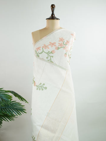 Cottons In soft cream tones, this Kora Cotton saree from Varanasi carries a light, graceful charm.br
Floral motifs bloom gently across the body, untouched by zari for a pure, minimal look.br
Its airy texture makes it ideal for warm days and easy elegance.br
A timeless drape for those who love quiet beauty.br
#KoraCotton #FloralSaree #NoZariElegance #VaranasiWeaves #ManoranjithamSarees Jeevantika - Handloom Cotton Saree | Zari Border | Traditional - Manoranjitham Weaves - Handloom Store