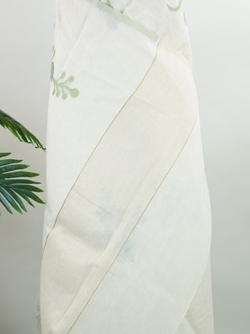Cottons In soft cream tones, this Kora Cotton saree from Varanasi carries a light, graceful charm.br
Floral motifs bloom gently across the body, untouched by zari for a pure, minimal look.br
Its airy texture makes it ideal for warm days and easy elegance.br
A timeless drape for those who love quiet beauty.br
#KoraCotton #FloralSaree #NoZariElegance #VaranasiWeaves #ManoranjithamSarees Gautami - Handloom Cotton Saree | Zari Border | Traditional - Manoranjitham Weaves - Handloom Store