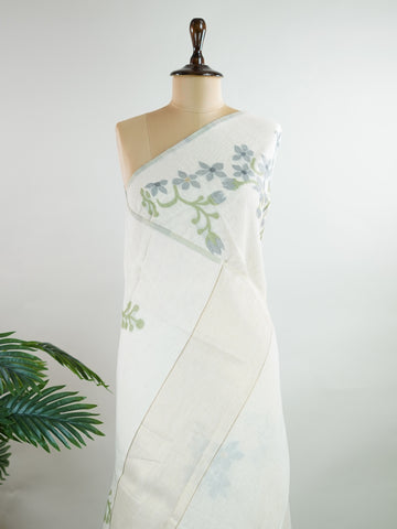 Cottons In soft cream tones, this Kora Cotton saree from Varanasi carries a light, graceful charm.br
Floral motifs bloom gently across the body, untouched by zari for a pure, minimal look.br
Its airy texture makes it ideal for warm days and easy elegance.br
A timeless drape for those who love quiet beauty.br
#KoraCotton #FloralSaree #NoZariElegance #VaranasiWeaves #ManoranjithamSarees Gautami - Handloom Cotton Saree | Zari Border | Traditional - Manoranjitham Weaves - Handloom Store