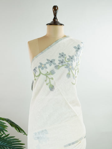 Cottons In soft cream tones, this Kora Cotton saree from Varanasi carries a light, graceful charm.br
Floral motifs bloom gently across the body, untouched by zari for a pure, minimal look.br
Its airy texture makes it ideal for warm days and easy elegance.br
A timeless drape for those who love quiet beauty.br
#KoraCotton #FloralSaree #NoZariElegance #VaranasiWeaves #ManoranjithamSarees Gautami - Handloom Cotton Saree | Zari Border | Traditional - Manoranjitham Weaves - Handloom Store