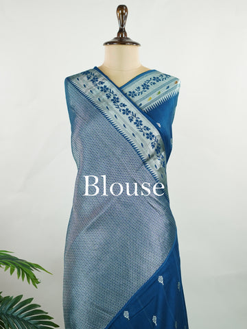 Georgette This Tussar Georgette saree from Varanasi brings together the textured richness of tussar silk with the fluid grace of georgette. Woven on a powerloom, it drapes light and airy, perfect for effortless elegance. Ideal for both day events and evening gatherings, it reflects quiet sophistication with a modern twist on tradition. Sharada - Georgette Saree | Handwoven | Varanasi - Manoranjitham Weaves - Handloom Store