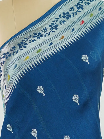 Georgette This Tussar Georgette saree from Varanasi brings together the textured richness of tussar silk with the fluid grace of georgette. Woven on a powerloom, it drapes light and airy, perfect for effortless elegance. Ideal for both day events and evening gatherings, it reflects quiet sophistication with a modern twist on tradition. Sharada - Georgette Saree | Handwoven | Varanasi - Manoranjitham Weaves - Handloom Store