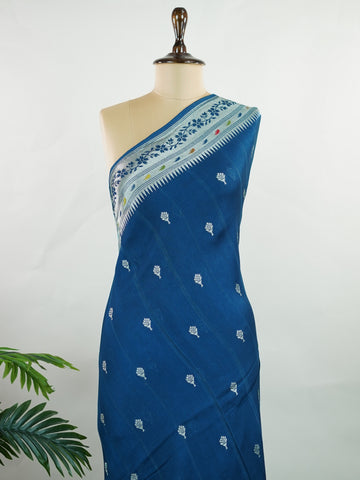 Georgette This Tussar Georgette saree from Varanasi brings together the textured richness of tussar silk with the fluid grace of georgette. Woven on a powerloom, it drapes light and airy, perfect for effortless elegance. Ideal for both day events and evening gatherings, it reflects quiet sophistication with a modern twist on tradition. Sharada - Georgette Saree | Handwoven | Varanasi - Manoranjitham Weaves - Handloom Store