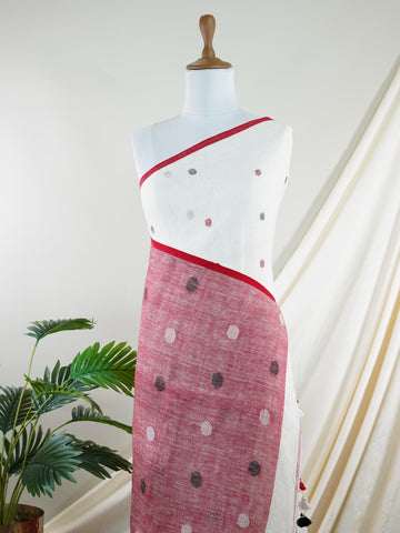 Linen This Linen silk saree, adorned in Red and detailed with nan weaving, reflects the grandeur of Gujarat. The timeless Handwork motifs enhance its bridal charm. A perfect blend of luxury and tradition, it is designed for those who appreciate fine craftsmanship. Miyan Malhara - Red Handloom Cotton Saree | Zari Border | Traditional - Manoranjitham Weaves - Handloom Store