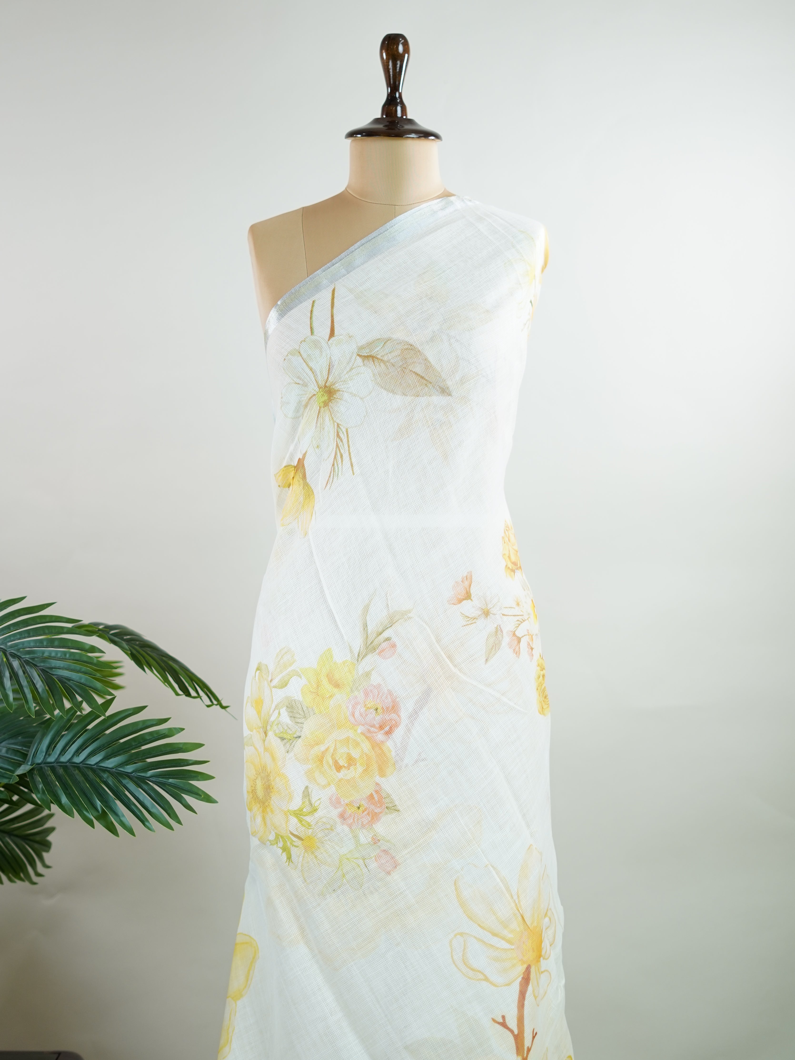 Linen A pristine white base adorned with multicolour floral motifs makes this Silk Kota saree a picture of elegance.br
Fine zari threads glint softly through the weave, adding a touch of celebration.br
Light as air and beautifully translucent, it’s ideal for summer occasions.br
A delicate dance of tradition and colour from Varanasi.br
#SilkKota #FloralElegance #WhiteSareeCharm #FineZariWeave #ManoranjithamSarees Brihadishvari - Multicolour Semi Silk Saree - Manoranjitham Weaves - Handloom Store