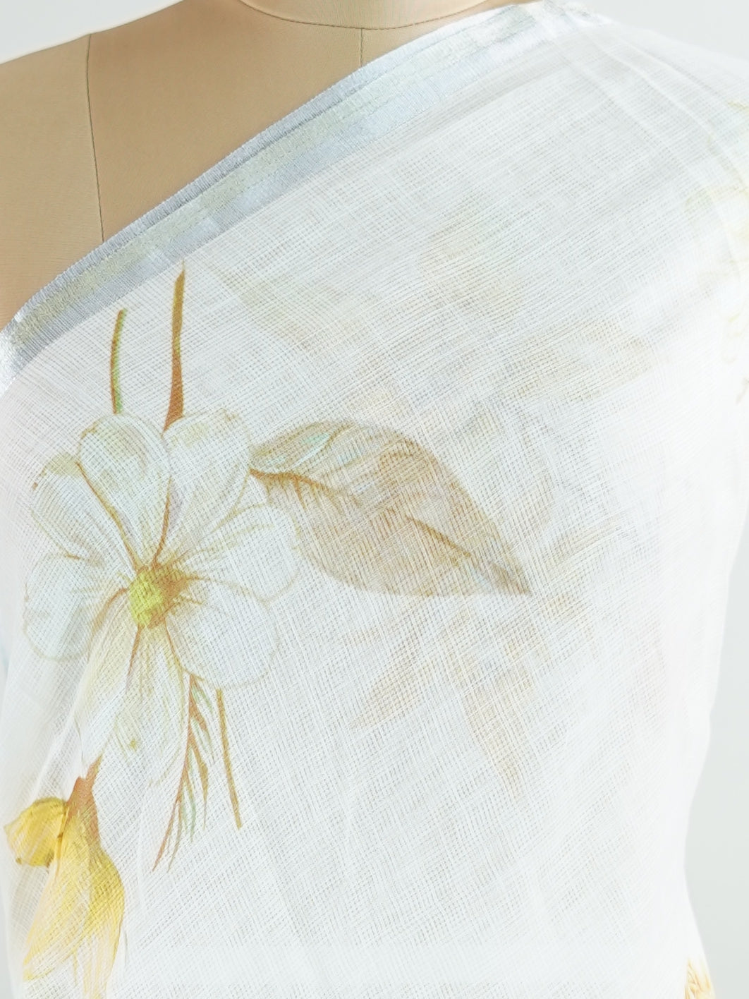 Linen A pristine white base adorned with multicolour floral motifs makes this Silk Kota saree a picture of elegance.br
Fine zari threads glint softly through the weave, adding a touch of celebration.br
Light as air and beautifully translucent, it’s ideal for summer occasions.br
A delicate dance of tradition and colour from Varanasi.br
#SilkKota #FloralElegance #WhiteSareeCharm #FineZariWeave #ManoranjithamSarees Brihadishvari - Multicolour Semi Silk Saree - Manoranjitham Weaves - Handloom Store