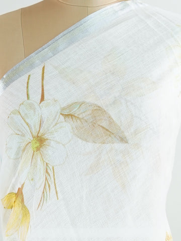 Linen A pristine white base adorned with multicolour floral motifs makes this Silk Kota saree a picture of elegance.br
Fine zari threads glint softly through the weave, adding a touch of celebration.br
Light as air and beautifully translucent, it’s ideal for summer occasions.br
A delicate dance of tradition and colour from Varanasi.br
#SilkKota #FloralElegance #WhiteSareeCharm #FineZariWeave #ManoranjithamSarees Brihadishvari - Multicolour Semi Silk Saree - Manoranjitham Weaves - Handloom Store