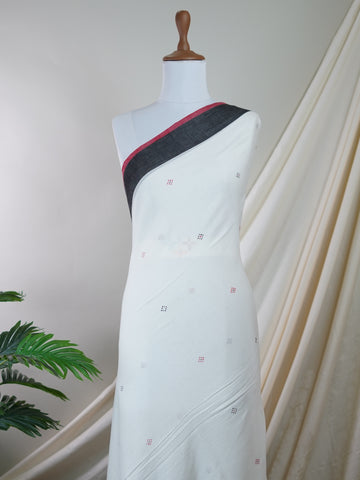 Handspun Cotton This 100% Pure Cotton silk saree, adorned in White and detailed with nan weaving, reflects the grandeur of West Bengal. The timeless Handwork motifs enhance its bridal charm. A perfect blend of luxury and tradition, it is designed for those who appreciate fine craftsmanship. Patdeepa - White Handloom Cotton Saree | Zari Border | Traditional - Manoranjitham Weaves - Handloom Store