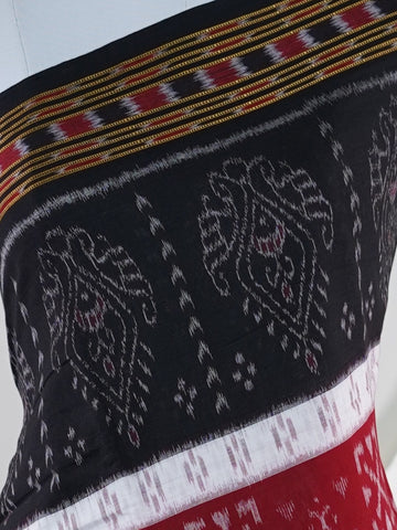 Handspun Cotton This 100% Pure Cotton silk saree, adorned in Black and detailed with nan weaving, reflects the grandeur of Orissa. The timeless Handwork motifs enhance its bridal charm. A perfect blend of luxury and tradition, it is designed for those who appreciate fine craftsmanship. Darbaria - Manoranjitham Weaves - Handloom Store