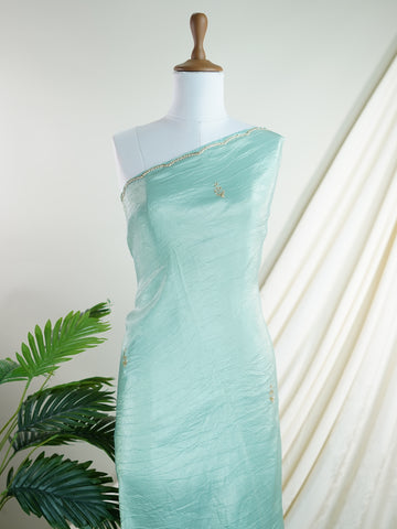 Organza Handwoven by skilled artisans of Karnataka, this 100% Pure Organza saree in Teal blends traditional elegance with intricate nan zari work. A truly stunning drape for special occasions. The interplay of colors and craftsmanship makes it a treasured piece for every saree connoisseur. Hindola - Teal Organza Saree - Manoranjitham Weaves - Handloom Store