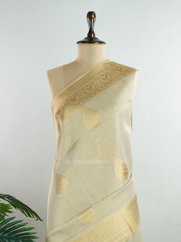 tissue This Kora Semi Tissue saree in rich gold features elegant stripes woven with fine zari. Lightweight and luminous, it captures the essence of festive finesse. Crafted in Varanasi, it drapes with ease and radiance. A timeless choice for celebrations with subtle grandeur. #KoraSemiTissue #GoldStripes #FineZari #VaranasiWeaves #ManoranjithamSarees Supriya - Gold Semi Silk Saree - Manoranjitham Weaves - Handloom Store