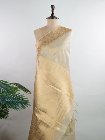 tissue This Kora Semi Tissue saree in rich gold features elegant stripes woven with fine zari. Lightweight and luminous, it captures the essence of festive finesse. Crafted in Varanasi, it drapes with ease and radiance. A timeless choice for celebrations with subtle grandeur. #KoraSemiTissue #GoldStripes #FineZari #VaranasiWeaves #ManoranjithamSarees Supriya - Gold Semi Silk Saree - Manoranjitham Weaves - Handloom Store