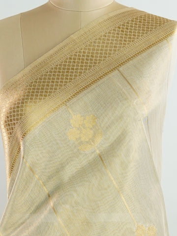 tissue This Kora Semi Tissue saree in rich gold features elegant stripes woven with fine zari. Lightweight and luminous, it captures the essence of festive finesse. Crafted in Varanasi, it drapes with ease and radiance. A timeless choice for celebrations with subtle grandeur. #KoraSemiTissue #GoldStripes #FineZari #VaranasiWeaves #ManoranjithamSarees Manasa - Gold Semi Silk Saree - Manoranjitham Weaves - Handloom Store