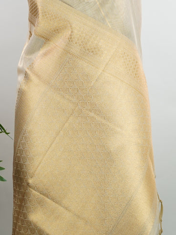 tissue This Kora Semi Tissue saree in rich gold features elegant stripes woven with fine zari. Lightweight and luminous, it captures the essence of festive finesse. Crafted in Varanasi, it drapes with ease and radiance. A timeless choice for celebrations with subtle grandeur. #KoraSemiTissue #GoldStripes #FineZari #VaranasiWeaves #ManoranjithamSarees Manasa - Gold Semi Silk Saree - Manoranjitham Weaves - Handloom Store