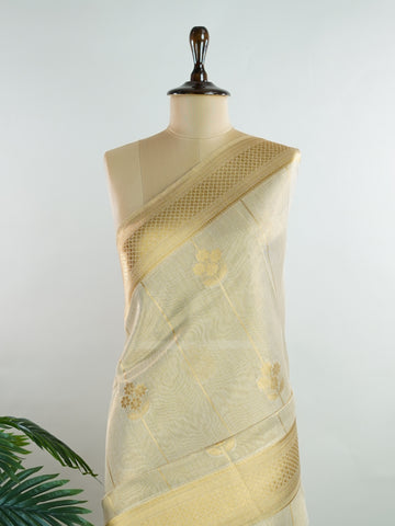 tissue This Kora Semi Tissue saree in rich gold features elegant stripes woven with fine zari. Lightweight and luminous, it captures the essence of festive finesse. Crafted in Varanasi, it drapes with ease and radiance. A timeless choice for celebrations with subtle grandeur. #KoraSemiTissue #GoldStripes #FineZari #VaranasiWeaves #ManoranjithamSarees Manasa - Gold Semi Silk Saree - Manoranjitham Weaves - Handloom Store