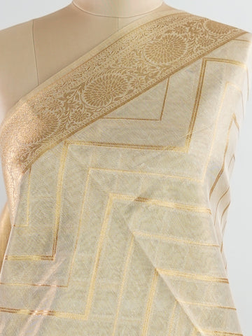 tissue This Kora Semi Tissue saree in rich gold features elegant stripes woven with fine zari. Lightweight and luminous, it captures the essence of festive finesse. Crafted in Varanasi, it drapes with ease and radiance. A timeless choice for celebrations with subtle grandeur. #KoraSemiTissue #GoldStripes #FineZari #VaranasiWeaves #ManoranjithamSarees Nirmala - Gold Semi Silk Saree - Manoranjitham Weaves - Handloom Store