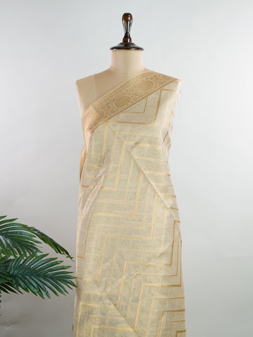tissue This Kora Semi Tissue saree in rich gold features elegant stripes woven with fine zari. Lightweight and luminous, it captures the essence of festive finesse. Crafted in Varanasi, it drapes with ease and radiance. A timeless choice for celebrations with subtle grandeur. #KoraSemiTissue #GoldStripes #FineZari #VaranasiWeaves #ManoranjithamSarees Nirmala - Gold Semi Silk Saree - Manoranjitham Weaves - Handloom Store