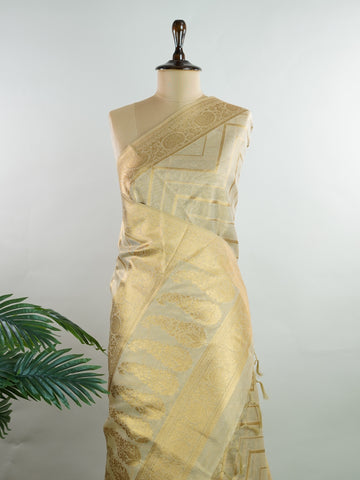 tissue This Kora Semi Tissue saree in rich gold features elegant stripes woven with fine zari. Lightweight and luminous, it captures the essence of festive finesse. Crafted in Varanasi, it drapes with ease and radiance. A timeless choice for celebrations with subtle grandeur. #KoraSemiTissue #GoldStripes #FineZari #VaranasiWeaves #ManoranjithamSarees Nirmala - Gold Semi Silk Saree - Manoranjitham Weaves - Handloom Store