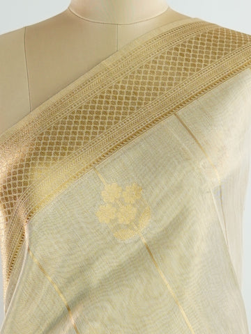 tissue This Kora Semi Tissue saree in rich gold features elegant stripes woven with fine zari. Lightweight and luminous, it captures the essence of festive finesse. Crafted in Varanasi, it drapes with ease and radiance. A timeless choice for celebrations with subtle grandeur. #KoraSemiTissue #GoldStripes #FineZari #VaranasiWeaves #ManoranjithamSarees Sukanya - Gold Semi Silk Saree - Manoranjitham Weaves - Handloom Store