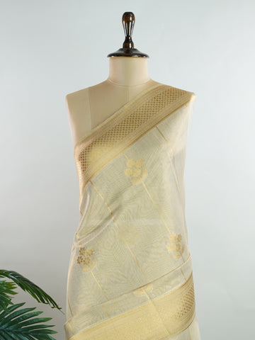 tissue This Kora Semi Tissue saree in rich gold features elegant stripes woven with fine zari. Lightweight and luminous, it captures the essence of festive finesse. Crafted in Varanasi, it drapes with ease and radiance. A timeless choice for celebrations with subtle grandeur. #KoraSemiTissue #GoldStripes #FineZari #VaranasiWeaves #ManoranjithamSarees Sukanya - Gold Semi Silk Saree - Manoranjitham Weaves - Handloom Store