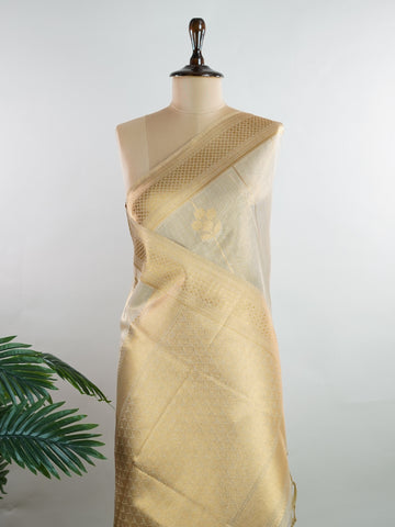 tissue This Kora Semi Tissue saree in rich gold features elegant stripes woven with fine zari. Lightweight and luminous, it captures the essence of festive finesse. Crafted in Varanasi, it drapes with ease and radiance. A timeless choice for celebrations with subtle grandeur. #KoraSemiTissue #GoldStripes #FineZari #VaranasiWeaves #ManoranjithamSarees Sukanya - Gold Semi Silk Saree - Manoranjitham Weaves - Handloom Store