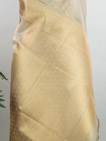 tissue This Kora Semi Tissue saree in rich gold features elegant stripes woven with fine zari. Lightweight and luminous, it captures the essence of festive finesse. Crafted in Varanasi, it drapes with ease and radiance. A timeless choice for celebrations with subtle grandeur. #KoraSemiTissue #GoldStripes #FineZari #VaranasiWeaves #ManoranjithamSarees Sukanya - Gold Semi Silk Saree - Manoranjitham Weaves - Handloom Store