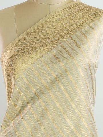 tissue This Kora Semi Tissue saree in rich gold features elegant stripes woven with fine zari. Lightweight and luminous, it captures the essence of festive finesse. Crafted in Varanasi, it drapes with ease and radiance. A timeless choice for celebrations with subtle grandeur. #KoraSemiTissue #GoldStripes #FineZari #VaranasiWeaves #ManoranjithamSarees Gautami - Manoranjitham Weaves - Handloom Store