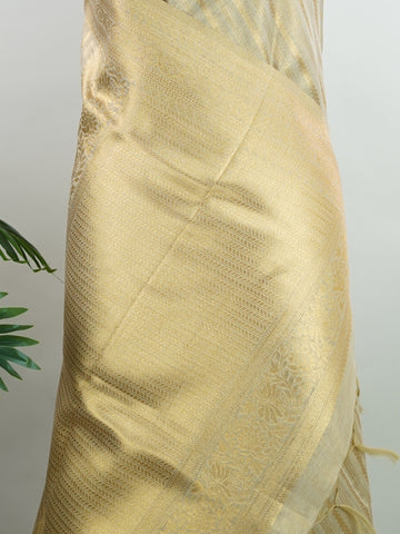 tissue This Kora Semi Tissue saree in rich gold features elegant stripes woven with fine zari. Lightweight and luminous, it captures the essence of festive finesse. Crafted in Varanasi, it drapes with ease and radiance. A timeless choice for celebrations with subtle grandeur. #KoraSemiTissue #GoldStripes #FineZari #VaranasiWeaves #ManoranjithamSarees Gautami - Manoranjitham Weaves - Handloom Store
