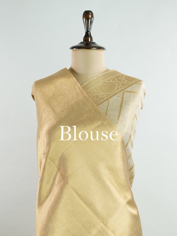 tissue This Kora Semi Tissue saree in rich gold features elegant stripes woven with fine zari. Lightweight and luminous, it captures the essence of festive finesse. Crafted in Varanasi, it drapes with ease and radiance. A timeless choice for celebrations with subtle grandeur. #KoraSemiTissue #GoldStripes #FineZari #VaranasiWeaves #ManoranjithamSarees Vasanti - Gold Semi Silk Saree - Manoranjitham Weaves - Handloom Store