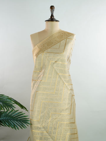 tissue This Kora Semi Tissue saree in rich gold features elegant stripes woven with fine zari. Lightweight and luminous, it captures the essence of festive finesse. Crafted in Varanasi, it drapes with ease and radiance. A timeless choice for celebrations with subtle grandeur. #KoraSemiTissue #GoldStripes #FineZari #VaranasiWeaves #ManoranjithamSarees Vasanti - Gold Semi Silk Saree - Manoranjitham Weaves - Handloom Store